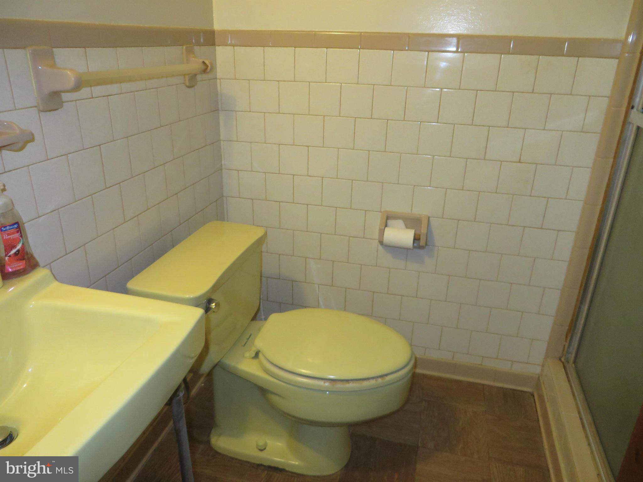 12200 Edgemont Street Silver Spring, MD 20902 - Photo 11 of 12 a bathroom with a toilet and a sink