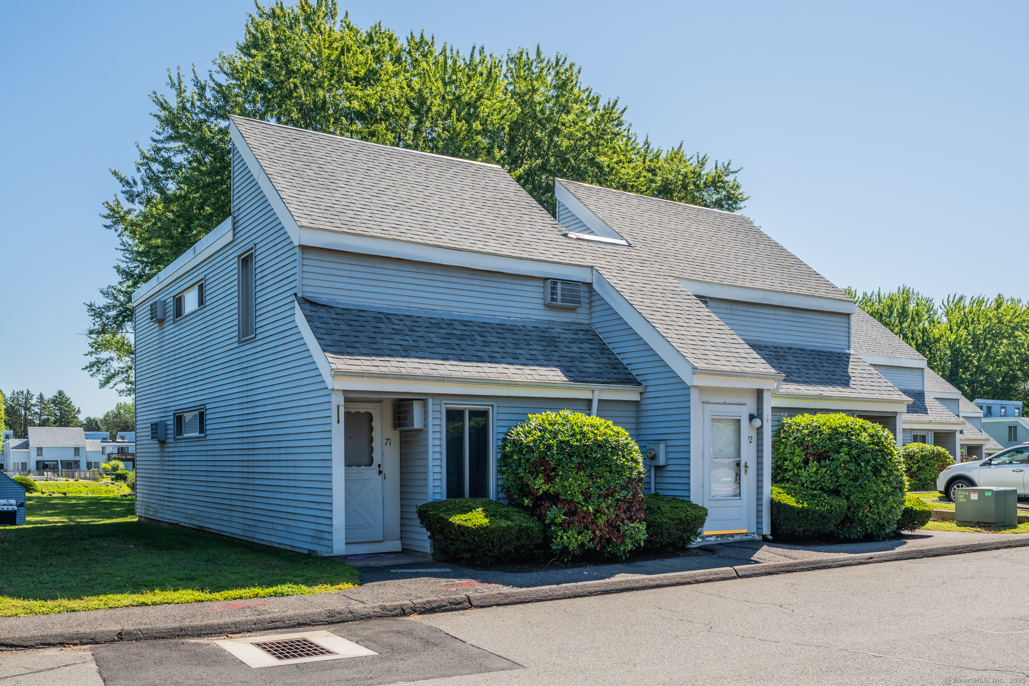 72 Cinnamon Spring, Unit 72 South Windsor, CT 06074 - Photo 1 of 1 a front view of a house with garden
