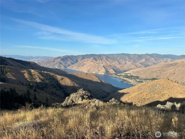 a view of ocean with mountain