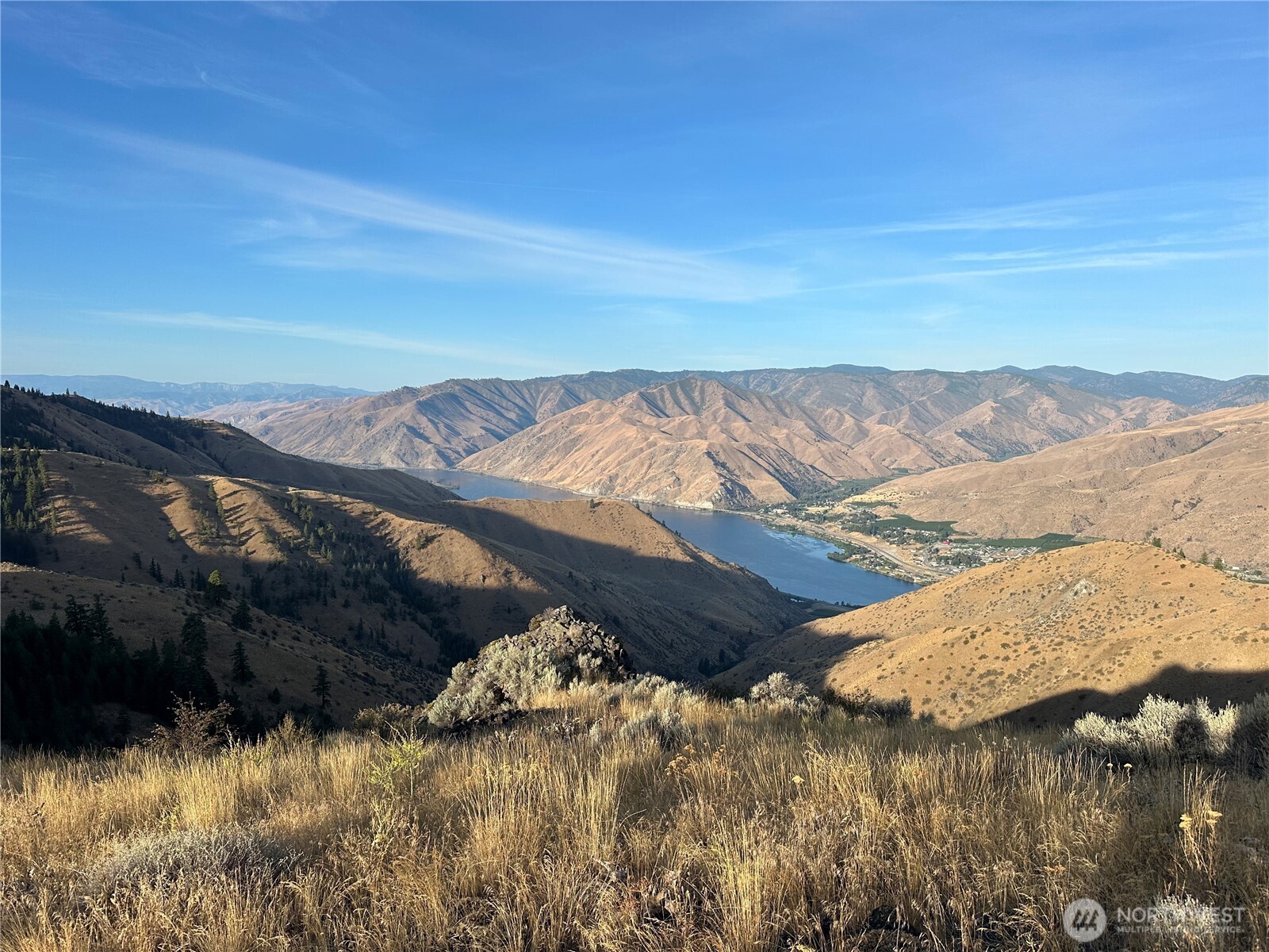 a view of ocean with mountain