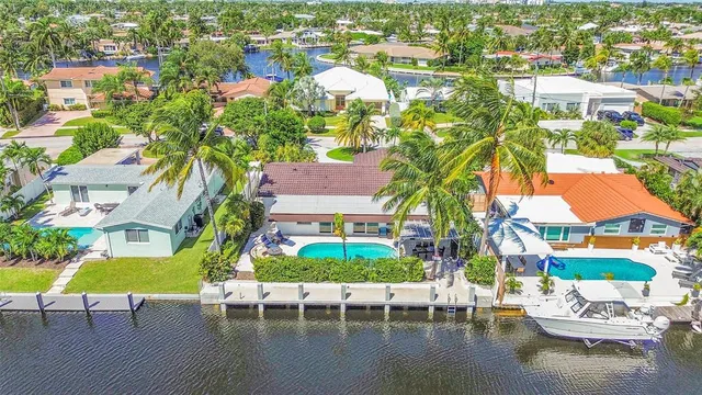 an aerial view of house with yard swimming pool and outdoor seating