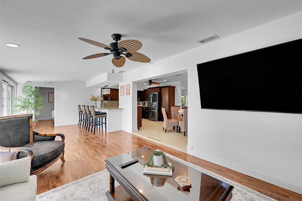 1080 Southeast 9th Avenue Pompano Beach, FL 33060 - Photo 15 of 53 a living room with furniture and a flat screen tv