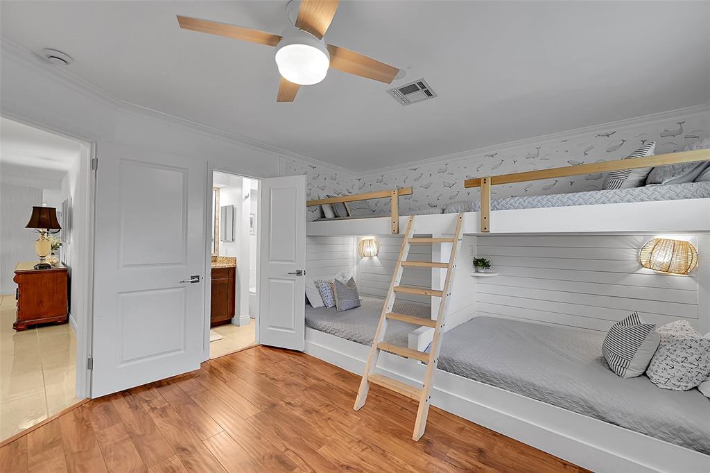 1080 Southeast 9th Avenue Pompano Beach, FL 33060 - Photo 31 of 53 a kitchen with stainless steel appliances wooden floor and chandelier