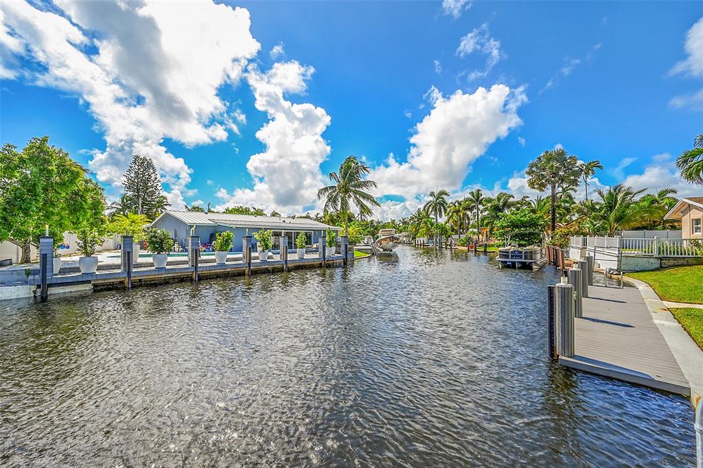 1080 Southeast 9th Avenue Pompano Beach, FL 33060 - Photo 36 of 53 a view of a swimming pool with an outdoor seating