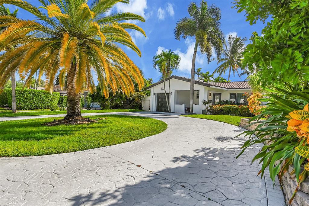 1080 Southeast 9th Avenue Pompano Beach, FL 33060 - Photo 40 of 53 a house with palm tree in front of it