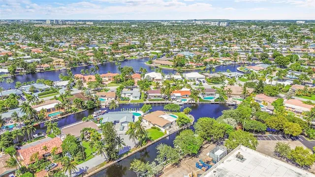 an aerial view of a houses with outdoor space and parking