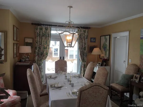 a dining room with furniture and window