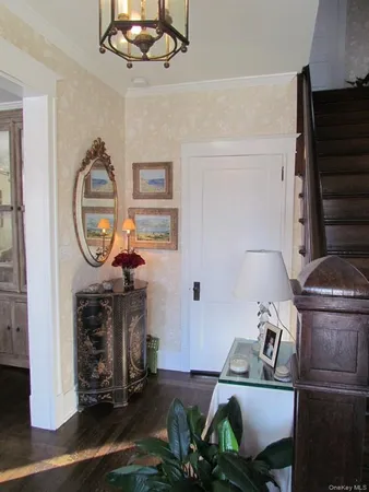 a living room with furniture a clock and a fireplace