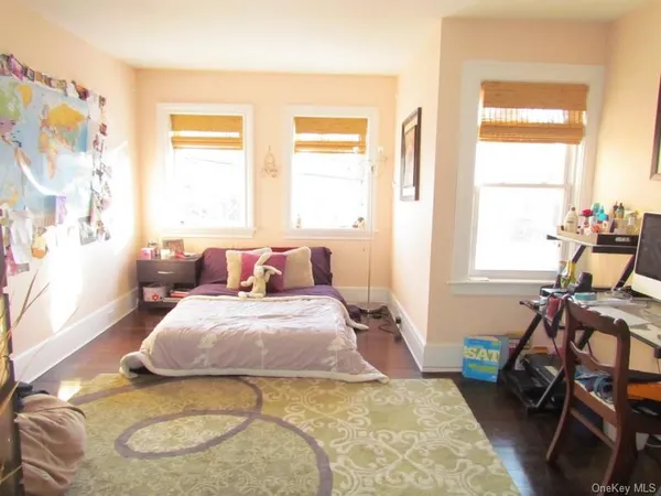 a bedroom with bed and a window