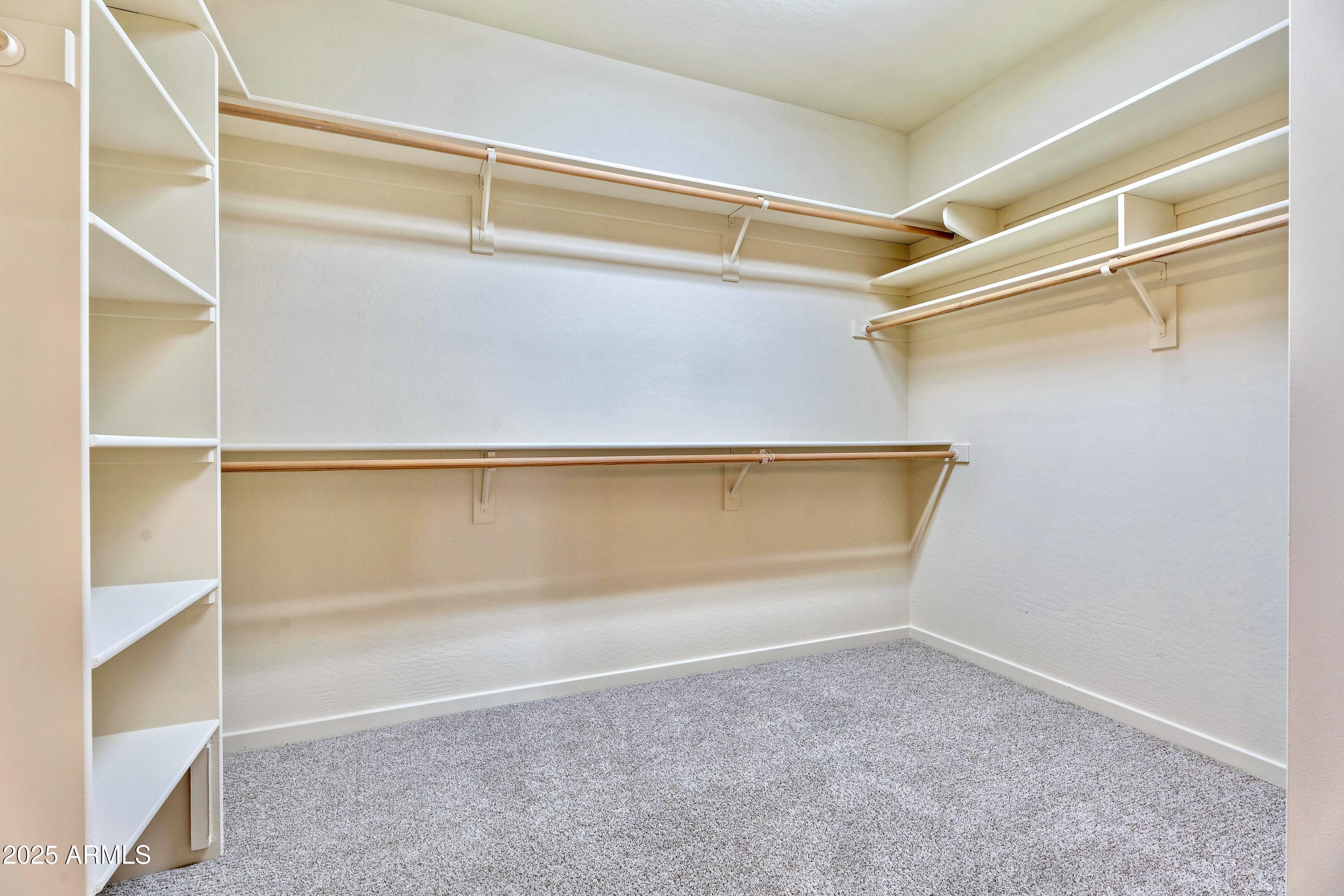 3830 East Carter Drive Phoenix, AZ 85042 - Photo 15 of 30 a view of an empty walk in closet