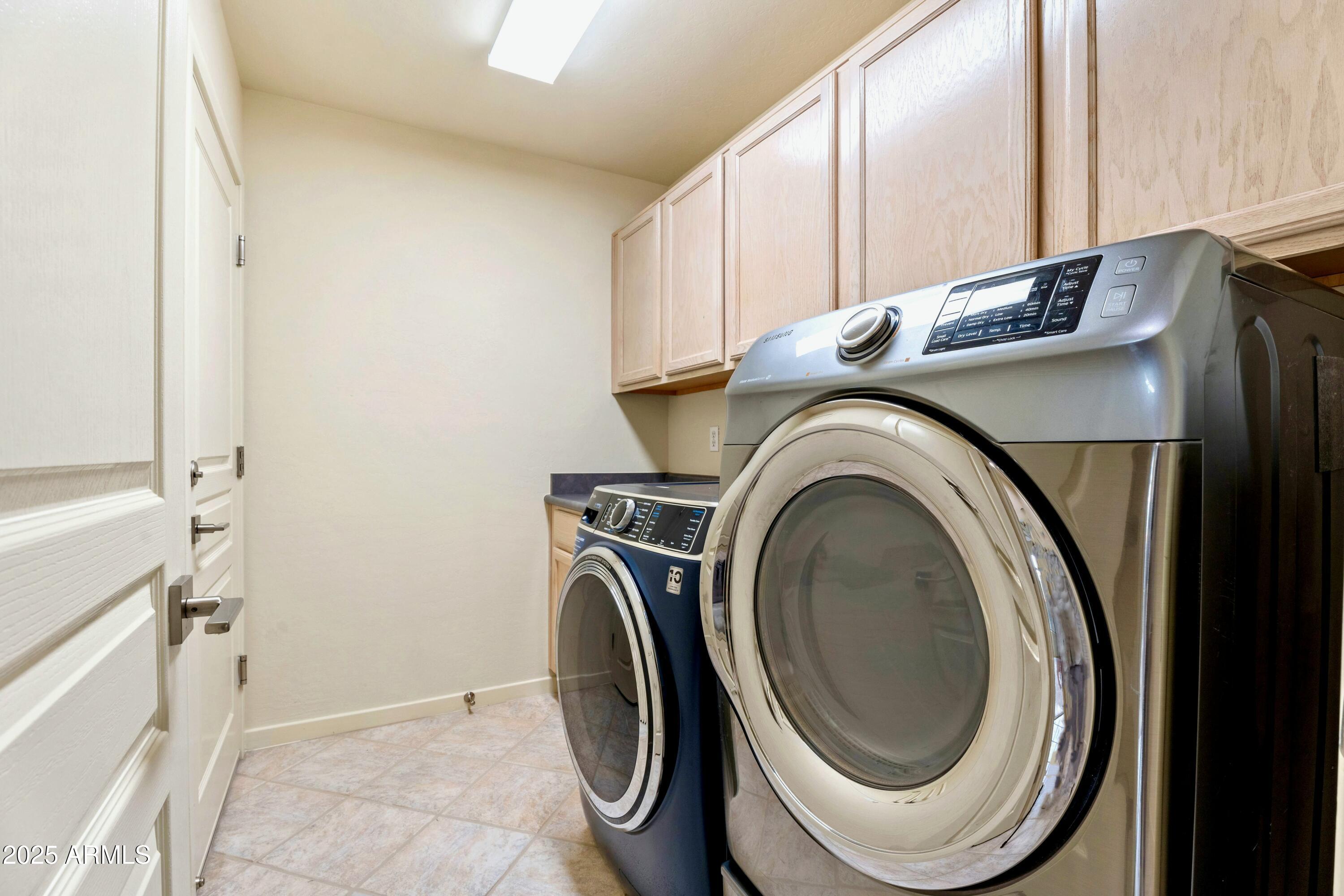 3830 East Carter Drive Phoenix, AZ 85042 - Photo 22 of 30 a utility room with sink dryer and washer