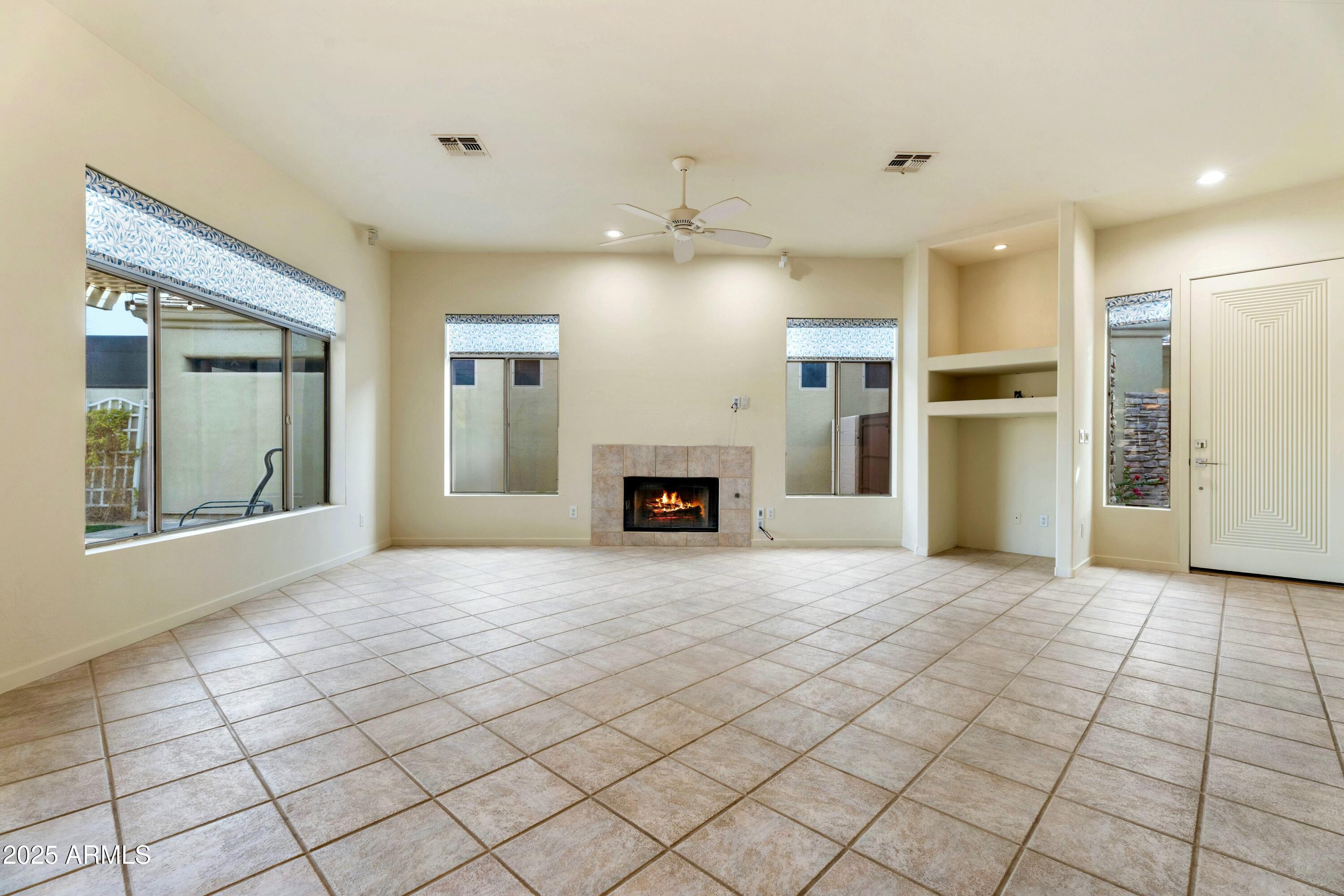 3830 East Carter Drive Phoenix, AZ 85042 - Photo 10 of 30 a view of a livingroom with a fireplace and window