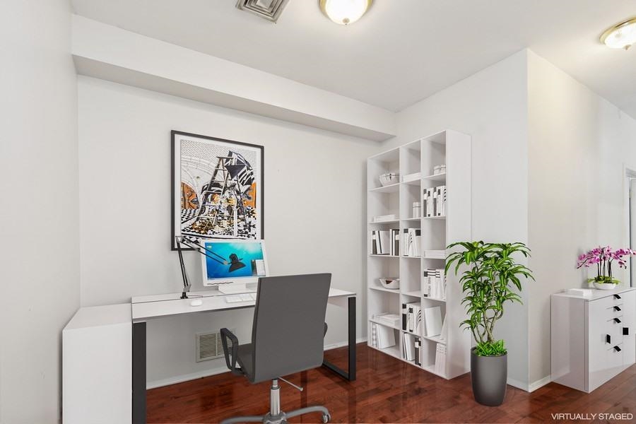 64 James Street, Unit 1 Newark, NJ 07102 - Photo 5 of 9 a view of a workspace with furniture and a potted plant