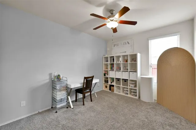 a bedroom with bed and a chandelier
