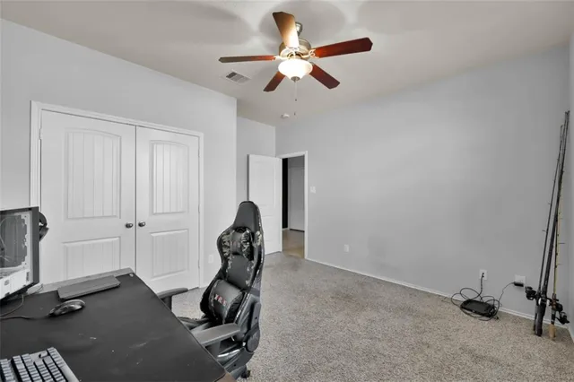 a work room with furniture and windows