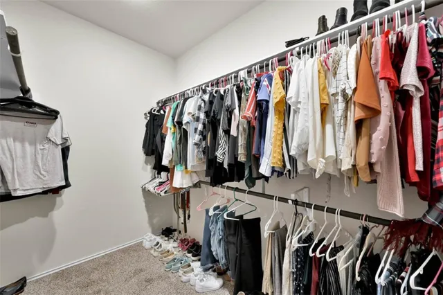 a large bathroom with a large tub sink shower and mirror