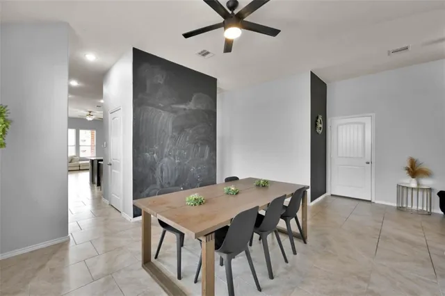 a view of a workspace with furniture