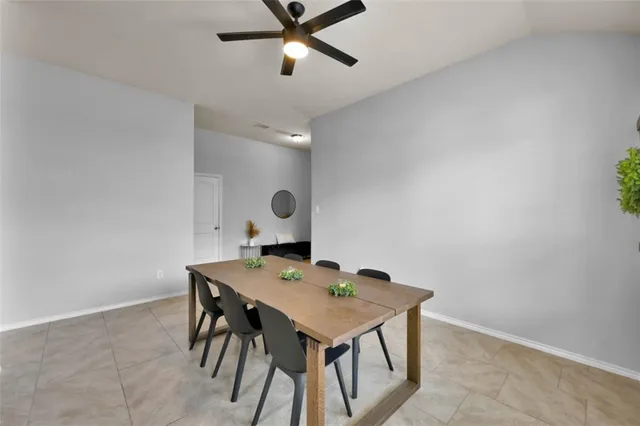 a kitchen with stainless steel appliances granite countertop wooden cabinets a stove a sink and a granite counter top