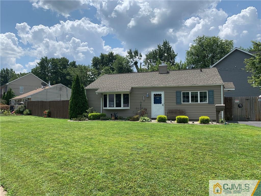 34 Windsor Road Edison, NJ 08817 - Photo 2 of 15 a front view of a house with a garden and trees