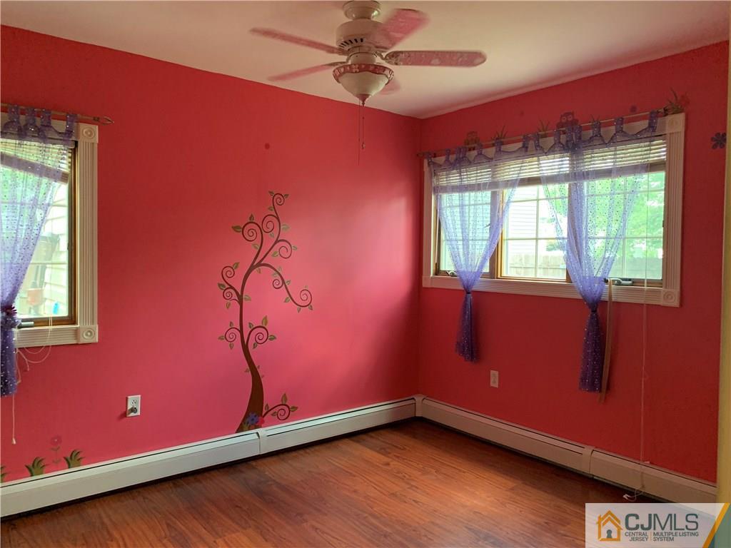 34 Windsor Road Edison, NJ 08817 - Photo 11 of 15 a view of an empty room with a window