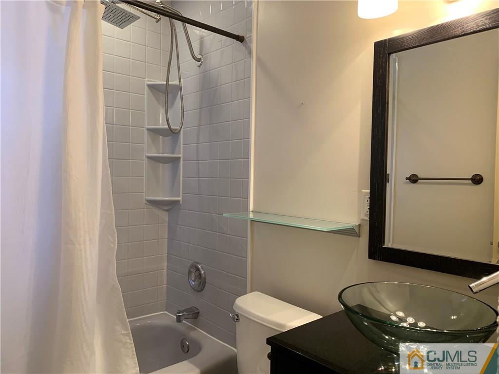 34 Windsor Road Edison, NJ 08817 - Photo 13 of 15 a bathroom with a sink toilet and shower