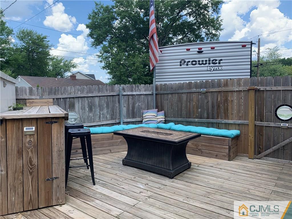 34 Windsor Road Edison, NJ 08817 - Photo 14 of 15 a view of swimming pool with a table and chairs