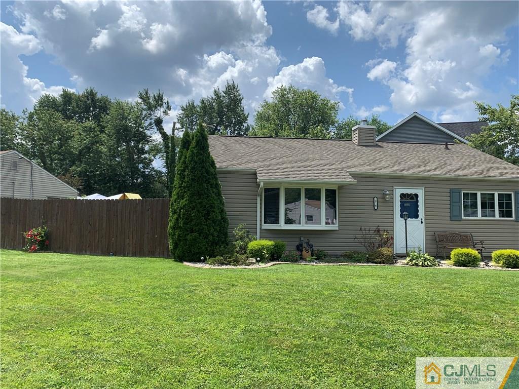 34 Windsor Road Edison, NJ 08817 - Photo 3 of 15 a view of a house with a yard and a garden