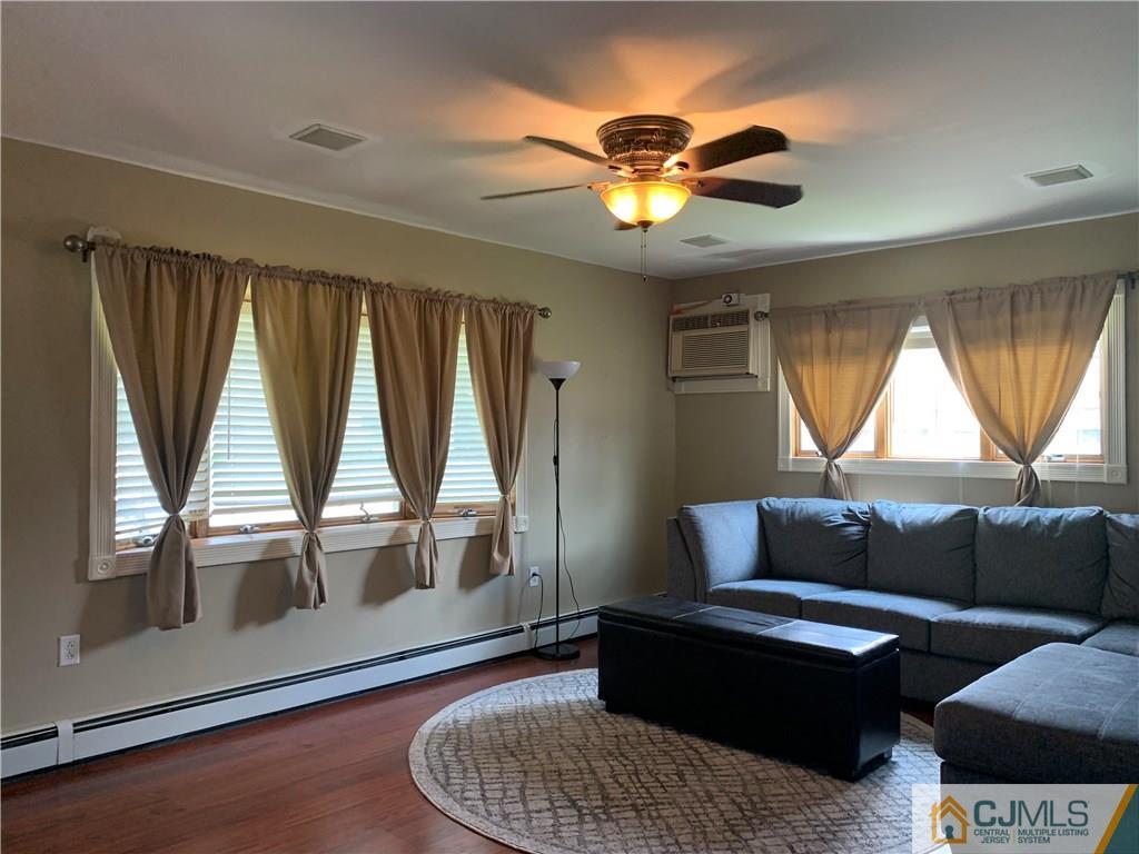 34 Windsor Road Edison, NJ 08817 - Photo 5 of 15 a living room with furniture and a large window