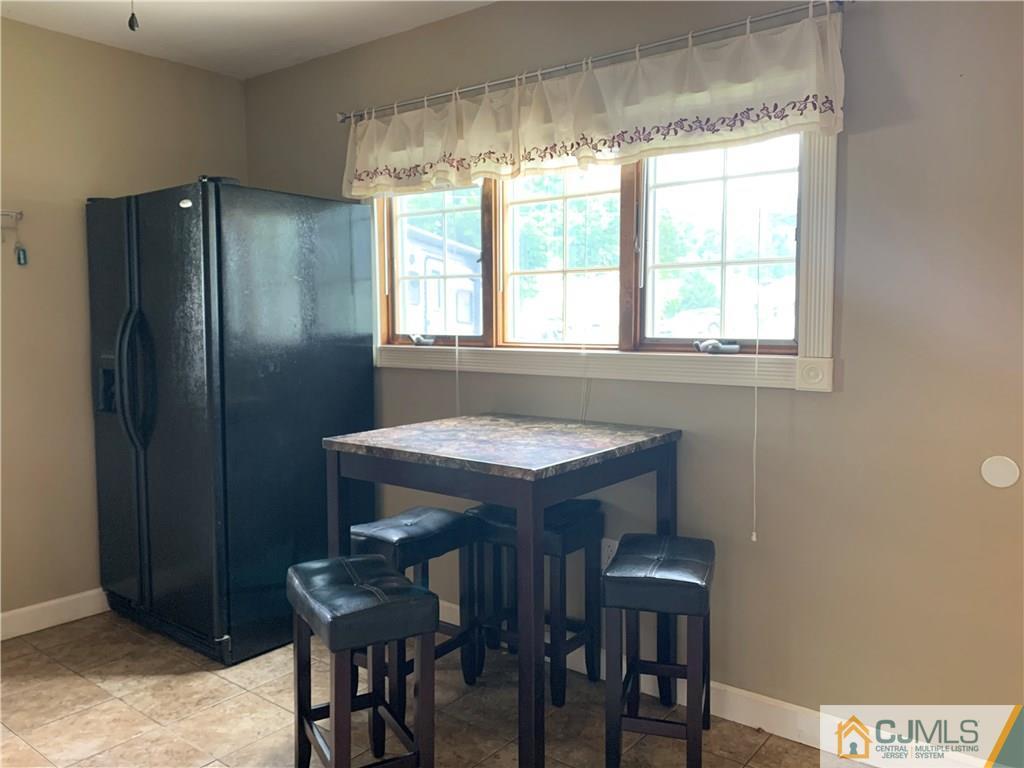 34 Windsor Road Edison, NJ 08817 - Photo 8 of 15 a kitchen with a table and chairs