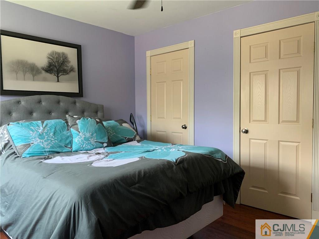 34 Windsor Road Edison, NJ 08817 - Photo 10 of 15 a bedroom with a bed and a painting on the wall