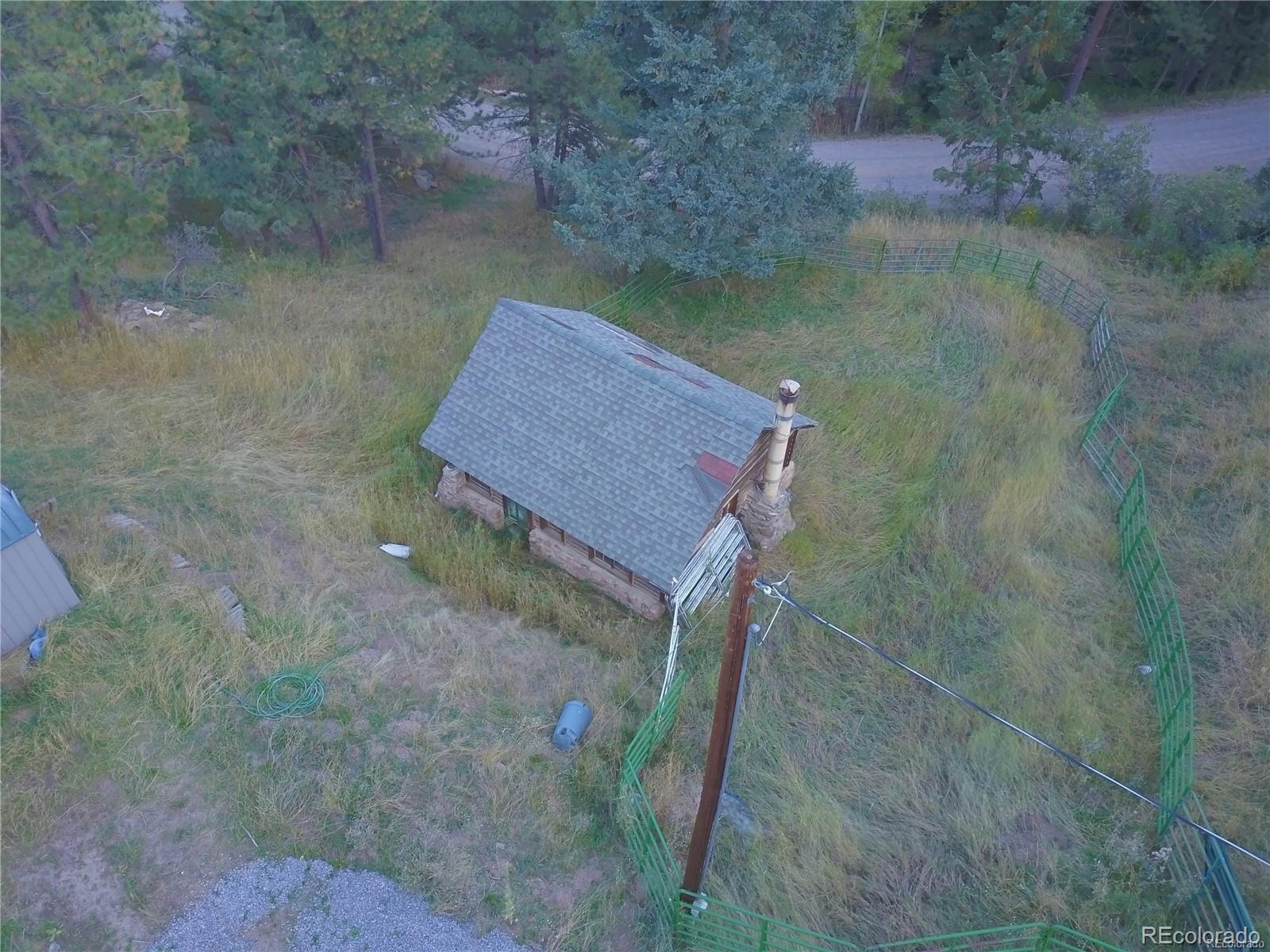10013 McKinney Road Littleton, CO 80127 - Photo 20 of 25 a small pool with some trees in the background