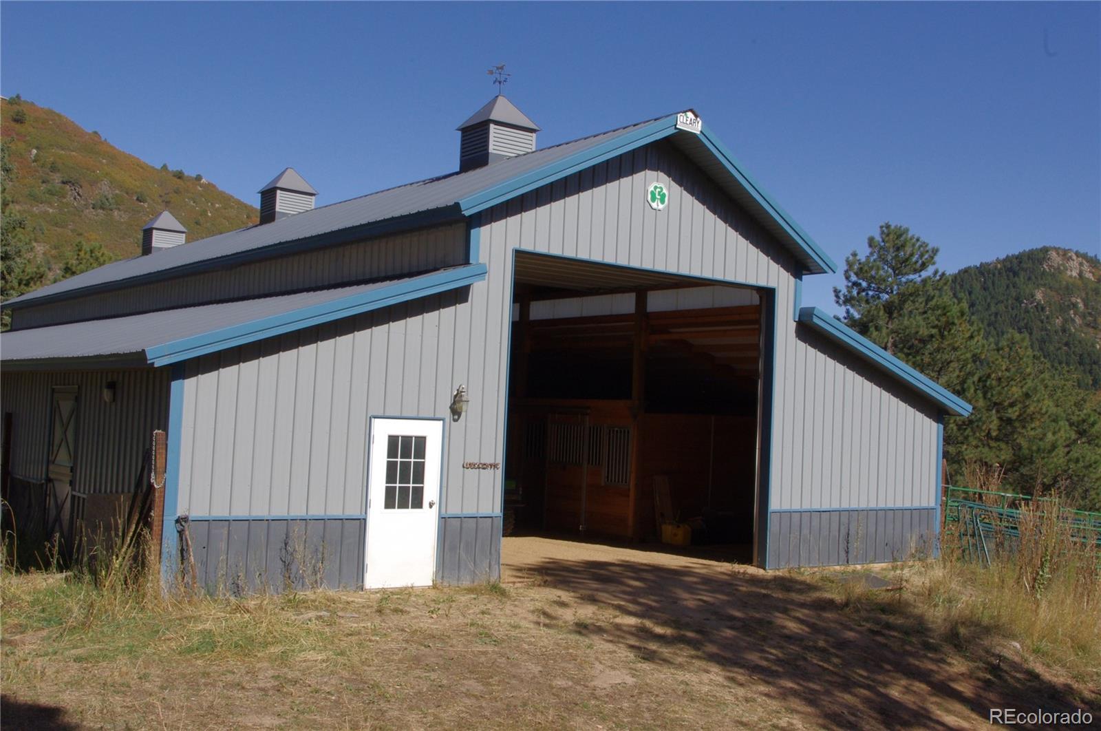 10013 McKinney Road Littleton, CO 80127 - Photo 2 of 25 a front view of a house with a yard