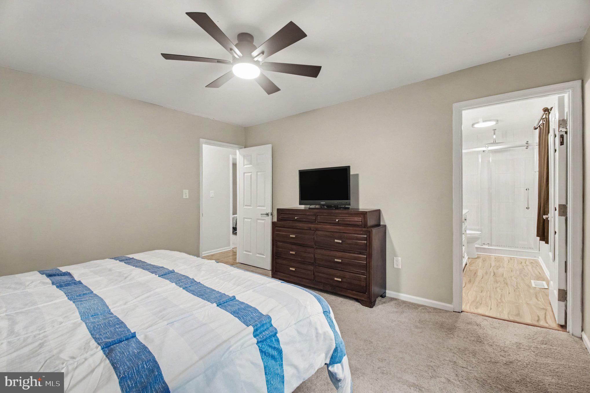 3901 Copperleaf Road Fredericksburg, VA 22407 - Photo 15 of 29 Primary Bedroom with Ceiling Fan and Bathroom