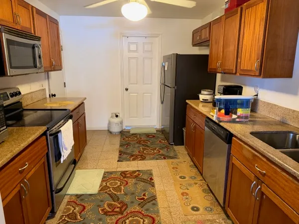 a kitchen with a stove and a microwave