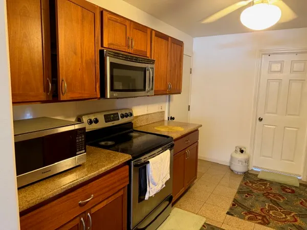 a kitchen with a sink stove and refrigerator