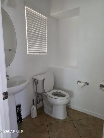 a bathroom with a toilet and a sink