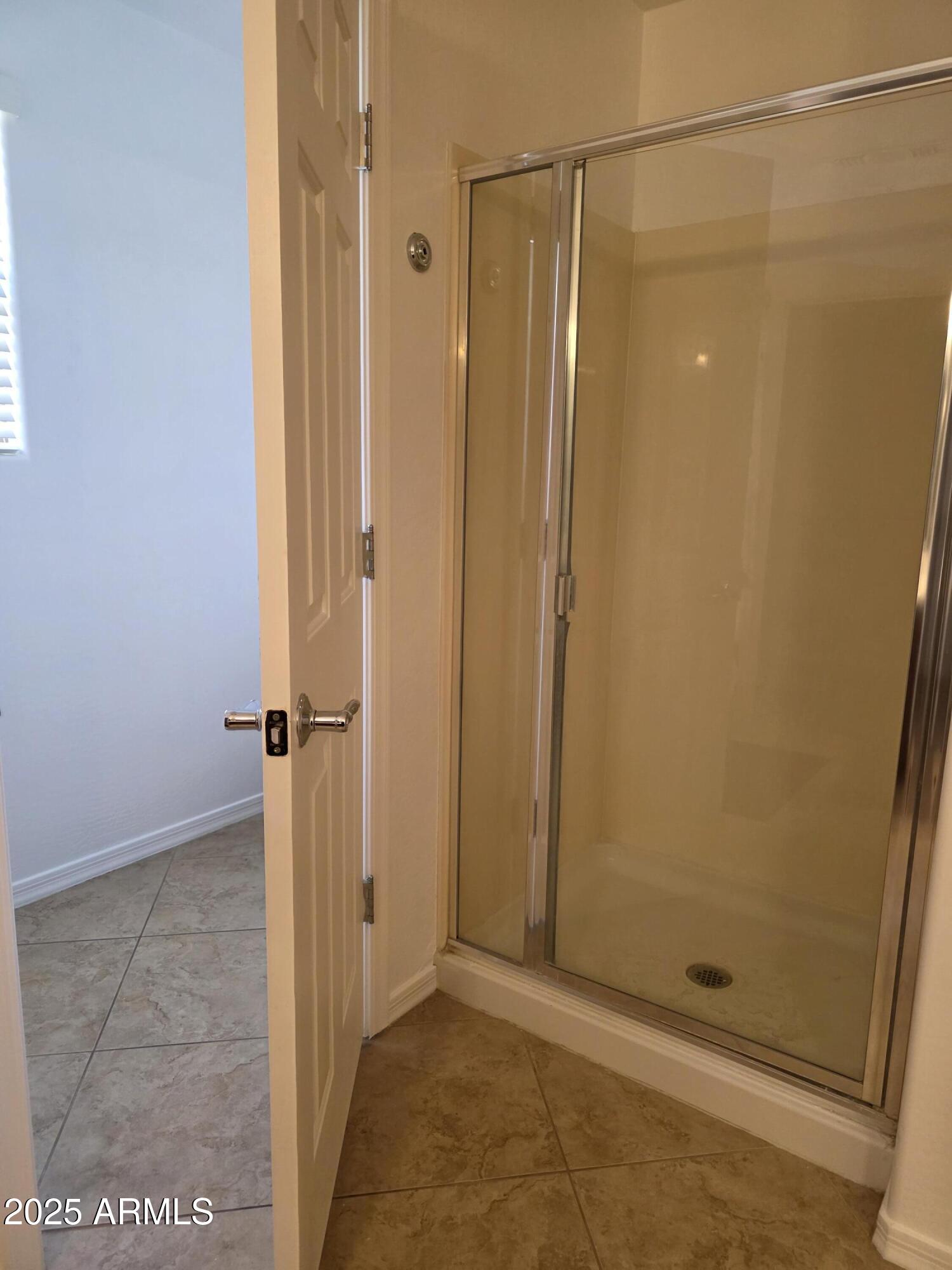 16206 North 22nd Lane Phoenix, AZ 85023 - Photo 16 of 29 a bathroom with a glass shower door