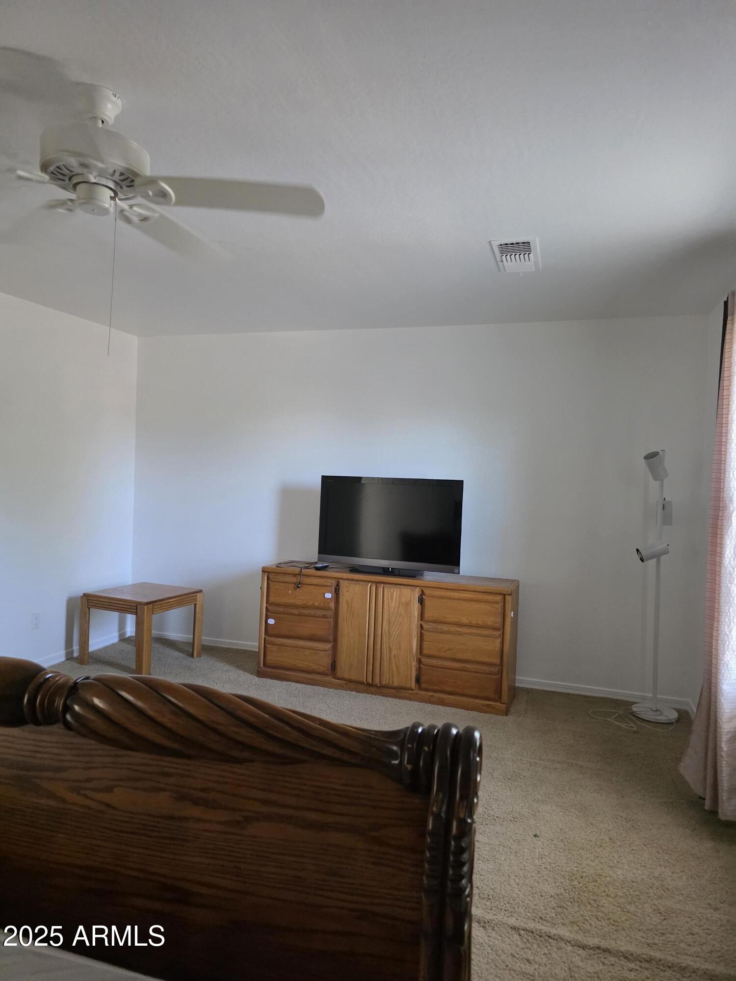 16206 North 22nd Lane Phoenix, AZ 85023 - Photo 18 of 29 a bedroom with a bed and flat screen tv