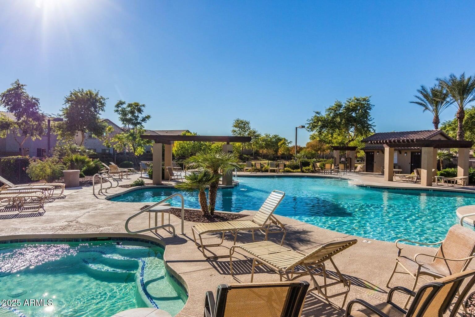 16206 North 22nd Lane Phoenix, AZ 85023 - Photo 27 of 29 a view of a patio with table and chairs potted plants and palm tree
