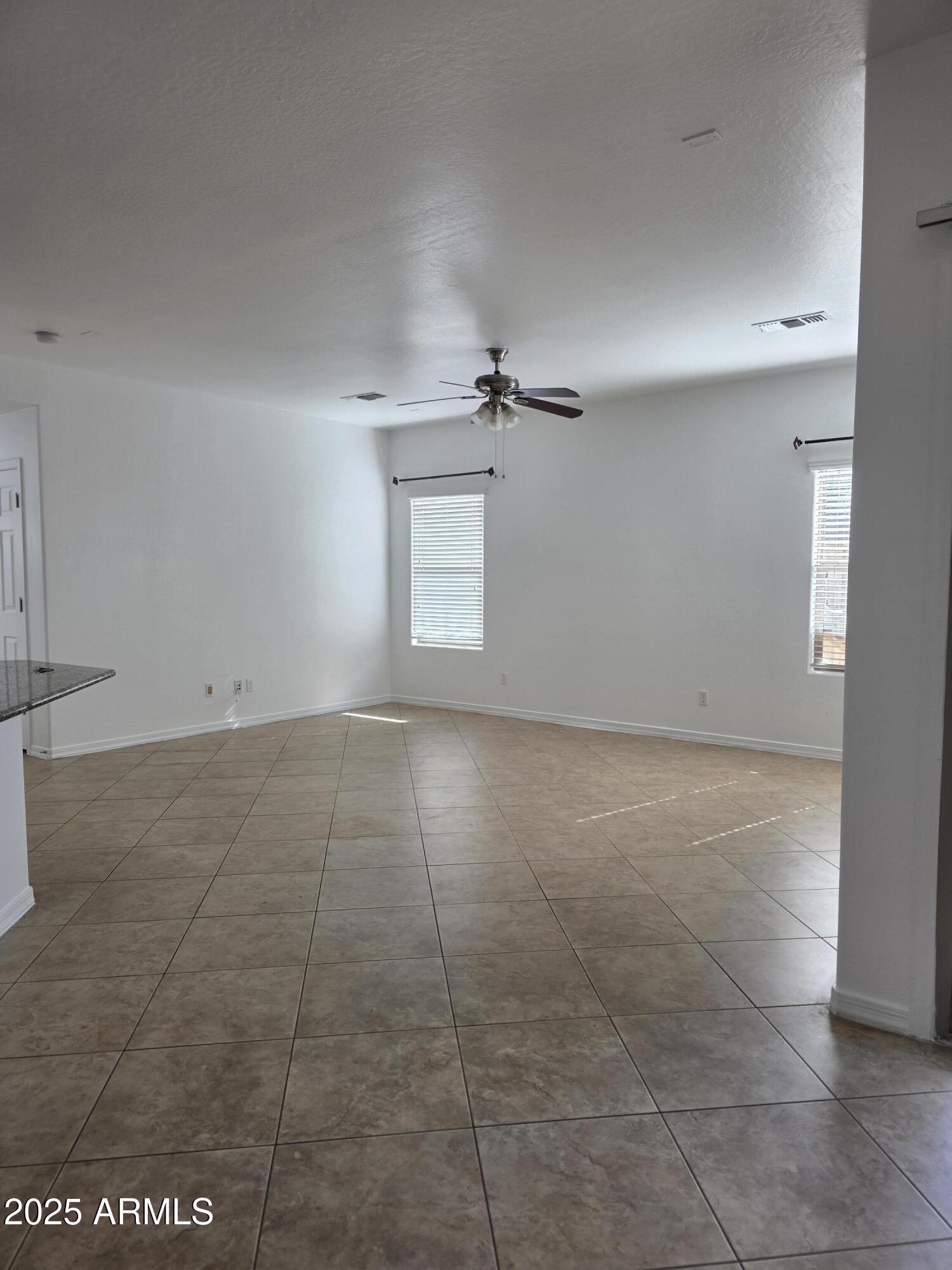 16206 North 22nd Lane Phoenix, AZ 85023 - Photo 6 of 29 an empty room with a empty space and windows