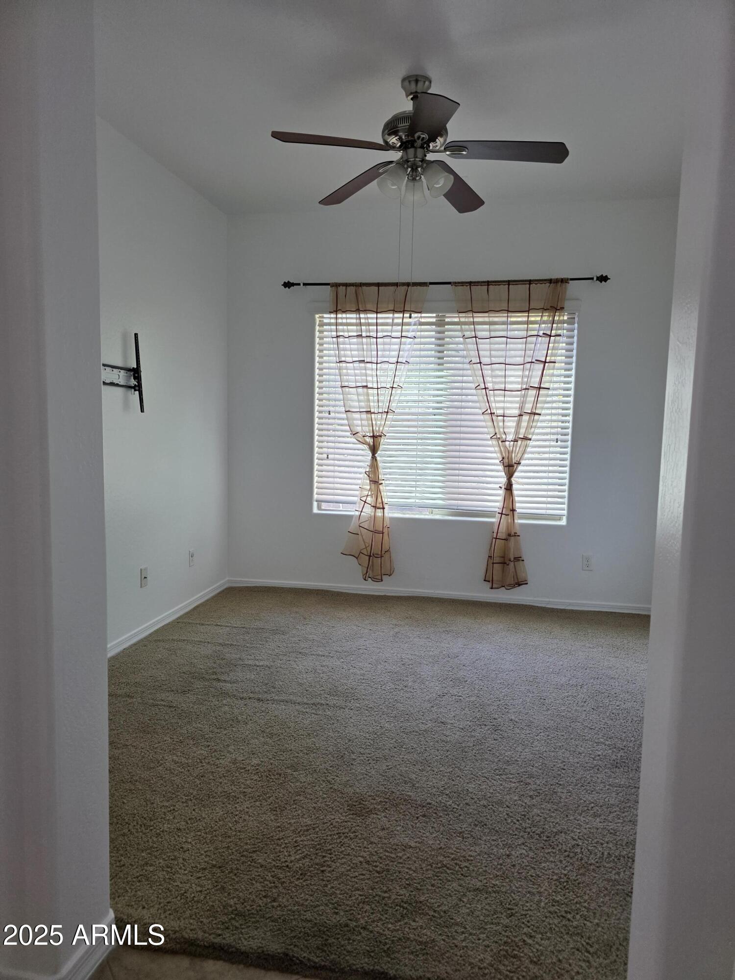 16206 North 22nd Lane Phoenix, AZ 85023 - Photo 9 of 29 a view of an empty room with a window