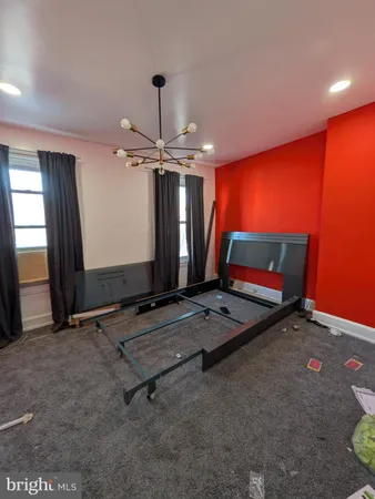 a room with pool table and windows