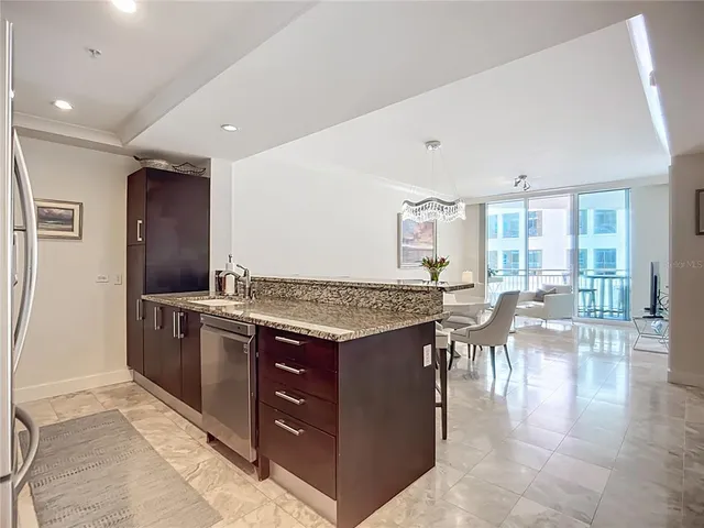 a kitchen with a stove and a refrigerator