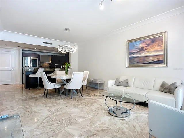 a living room with lots of furniture and white walls