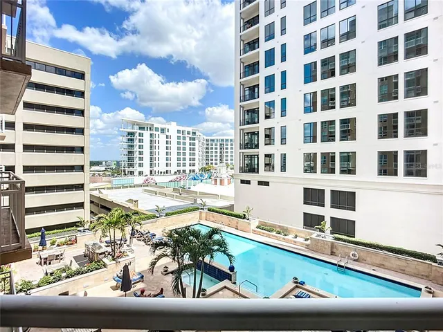a view of a swimming pool with a lounge chairs
