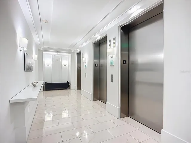 a view of a hallway with a bathroom