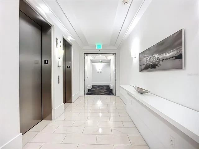 a view of a hallway with a white walls