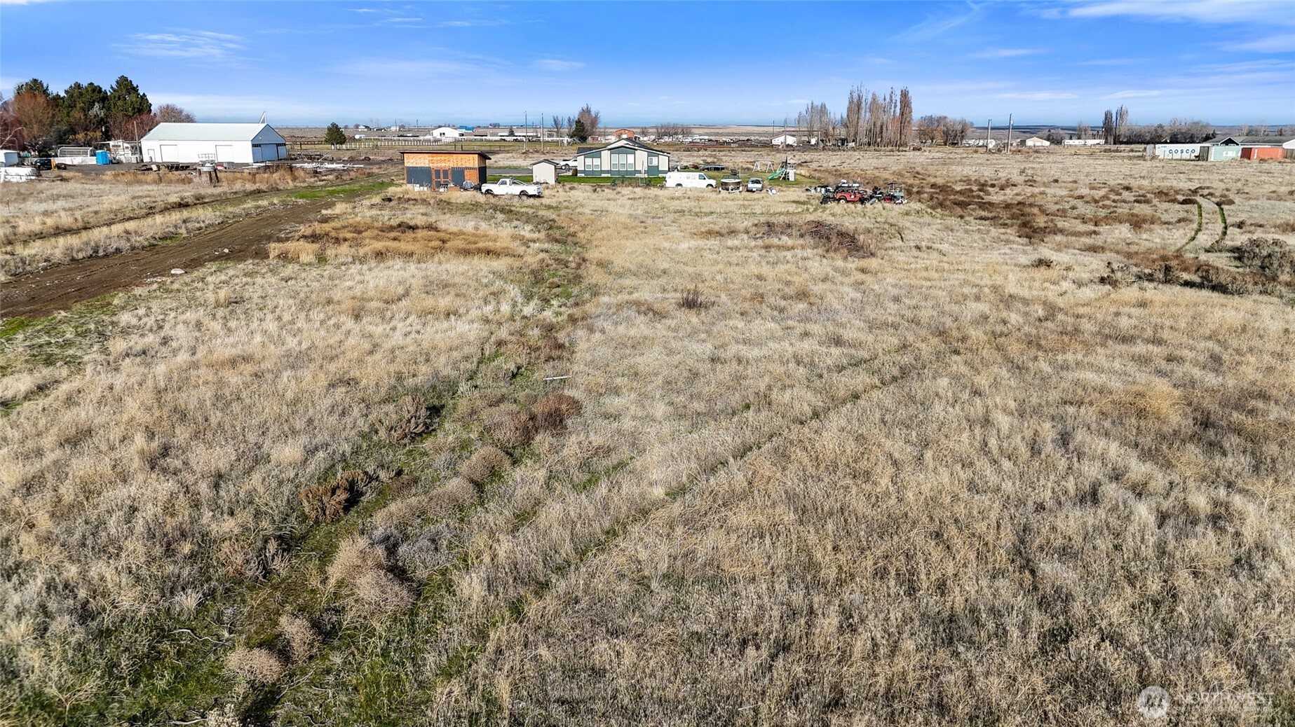 9613 Rd M Northeast Moses Lake, WA 98837 - Photo 16 of 17 a view of car parked on top of a beach