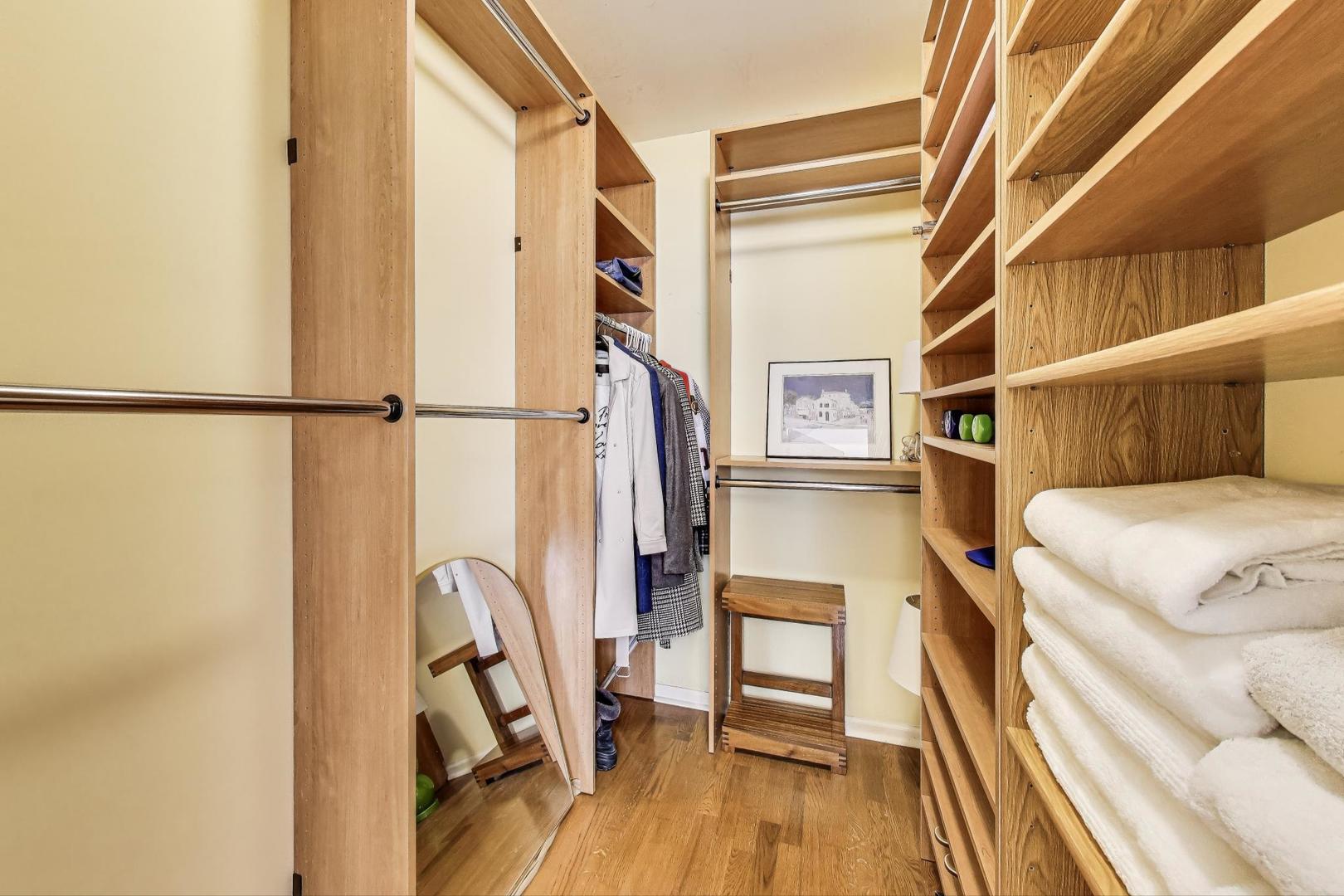 635 North Dearborn Street, Unit 2104 Chicago, IL 60654 - Photo 16 of 29 a view of walk in closet with clothes and shoes