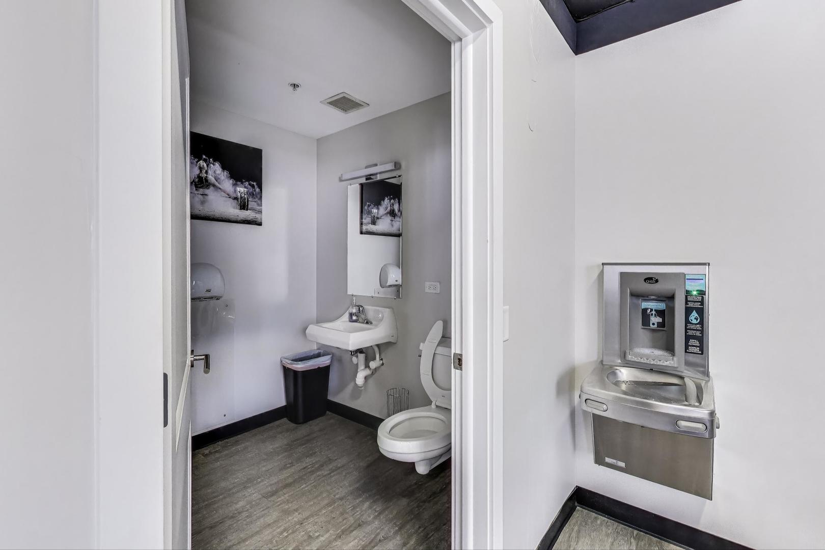 635 North Dearborn Street, Unit 2104 Chicago, IL 60654 - Photo 28 of 29 a bathroom with a toilet sink and shower